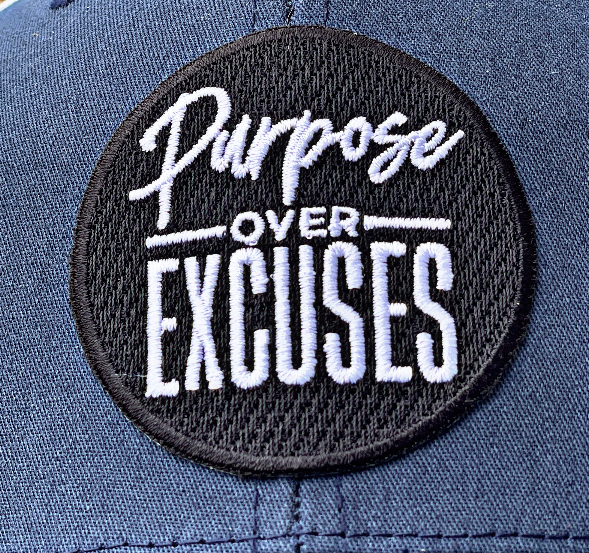 PURPOSE OVER EXCUSES TRUCKER HAT NAVY / WHITE