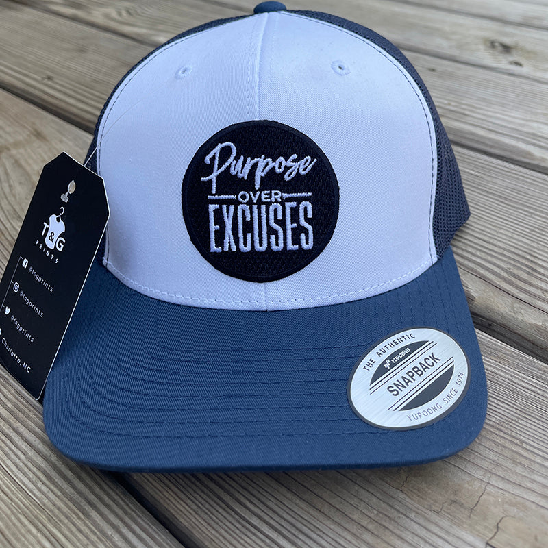 PURPOSE OVER EXCUSES TRUCKER HAT NAVY