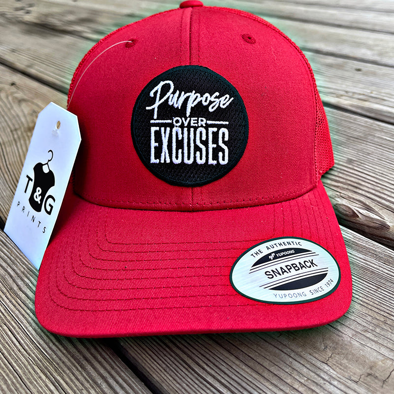 PURPOSE OVER EXCUSES TRUCKER HAT RED