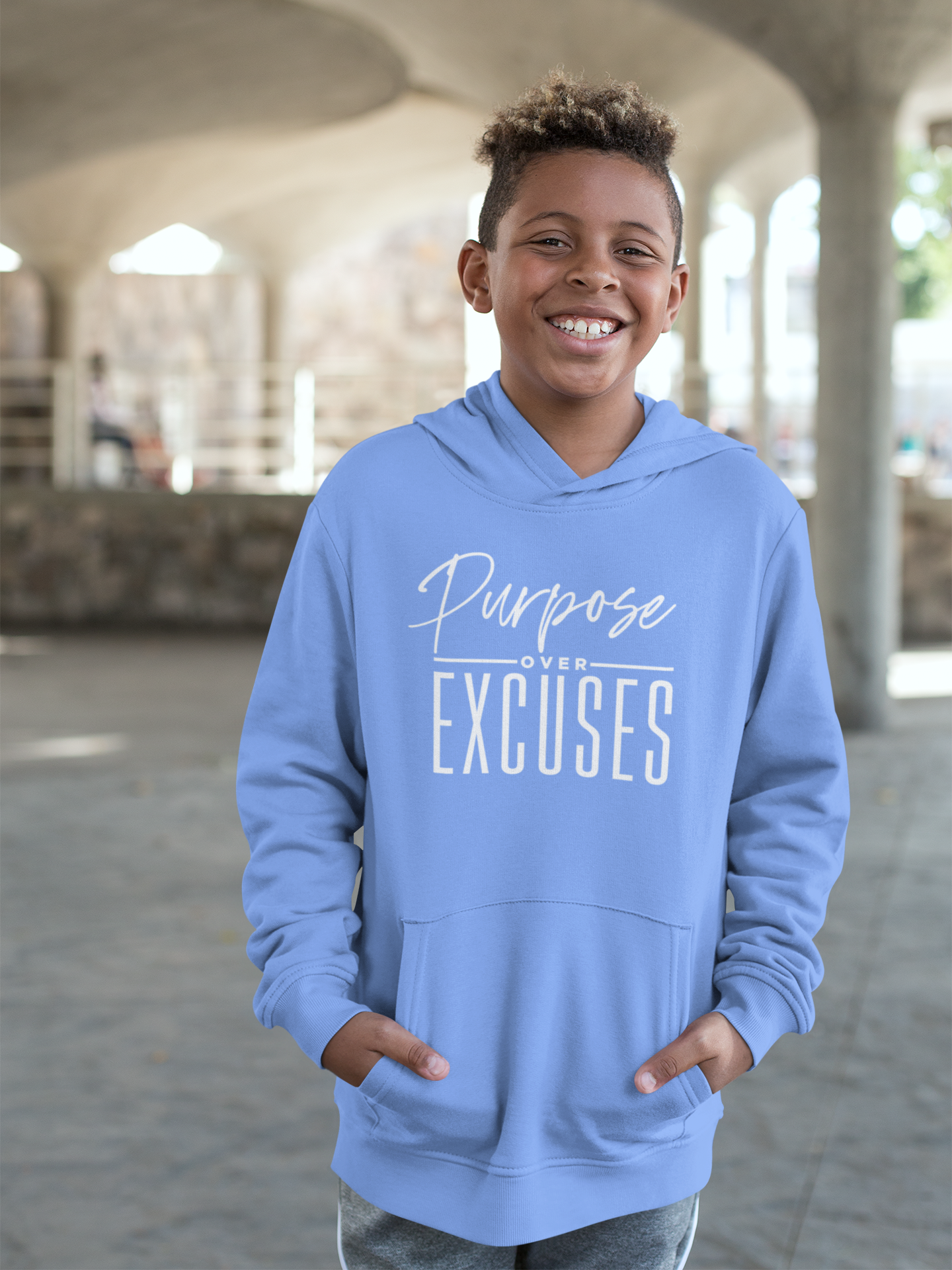 PURPOSE OVER EXCUSES YOUTH HOODIE CAROLINA BLUE